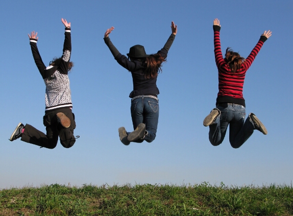 three girls jump