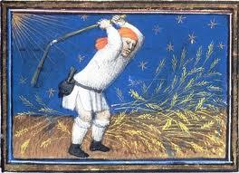 man winnowing wheat